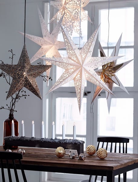 Scandi style Christmas dining table with metal star decorations